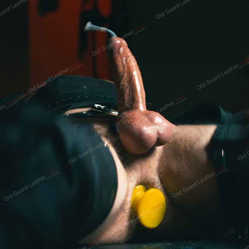 picture from a session of cum control by master lupus on old guard leather website
