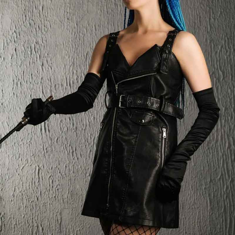 a dressed mistress ready to punish bad behavior with a riding crop
