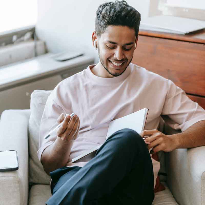 a young dom man thinking at how to structure the chastity training for behavior modification