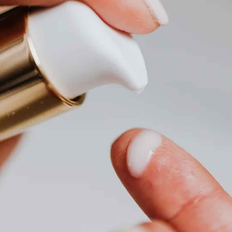 chastity lotion being applied on human finger